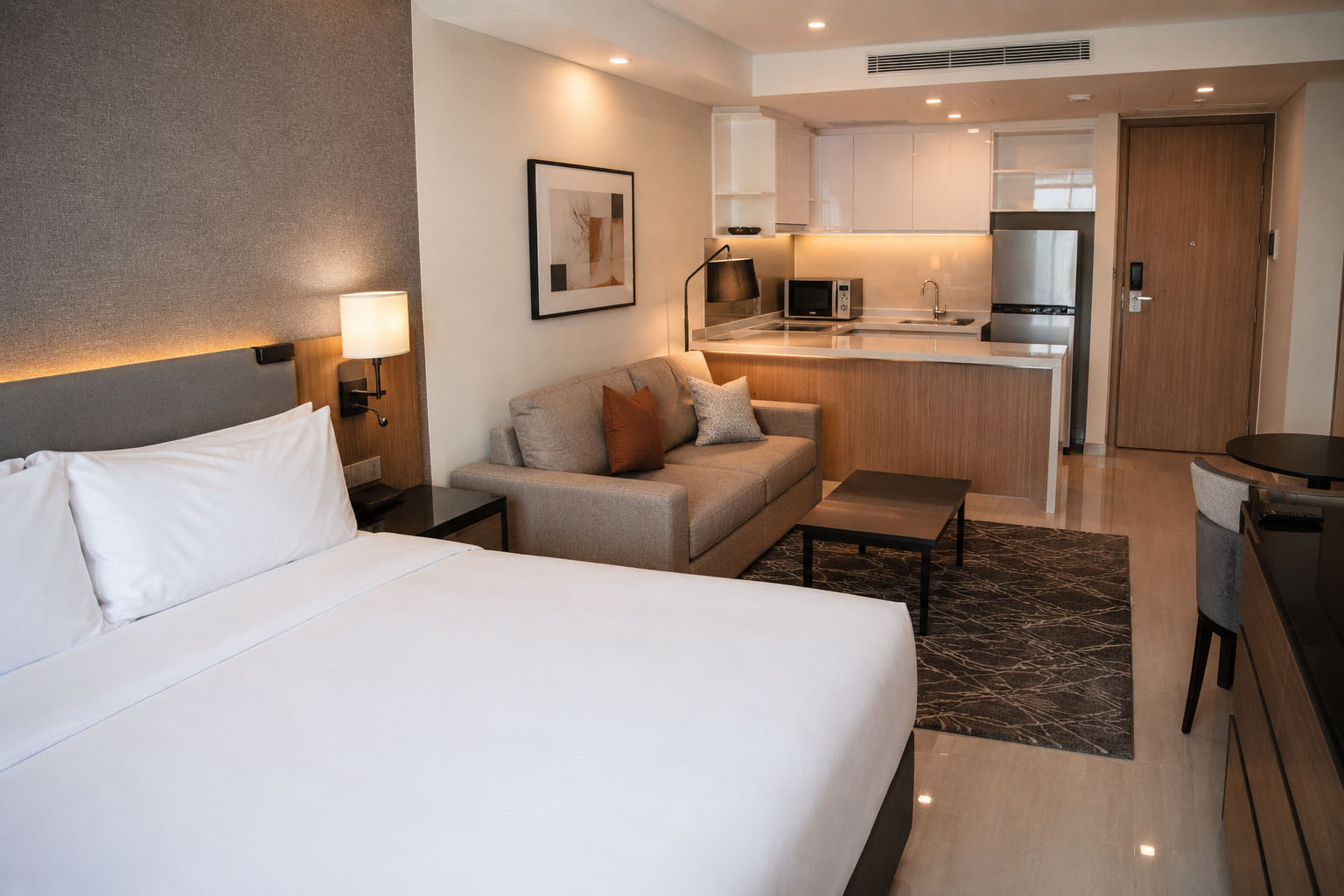 Extended stay suite with kitchenette and living area